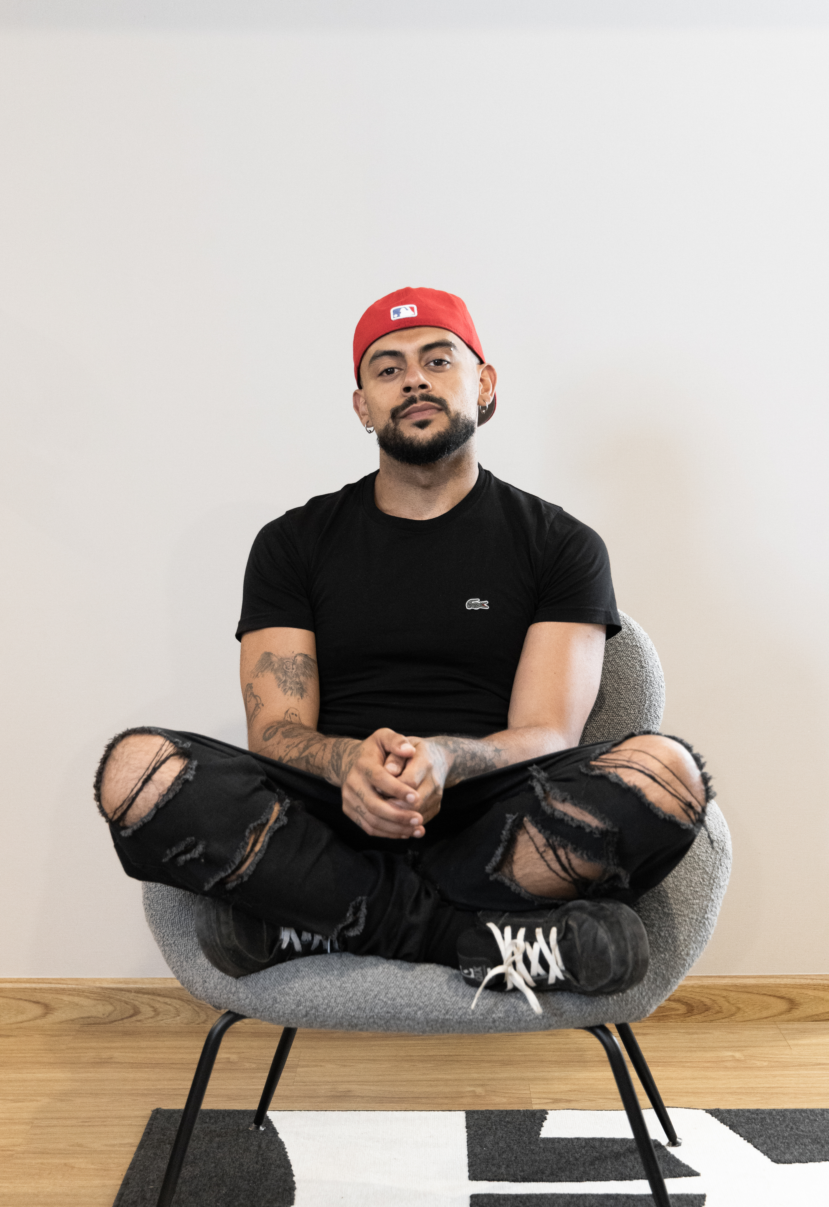 Portrait of the blog owner with face partially distorted through two clear glasses of water on a white table